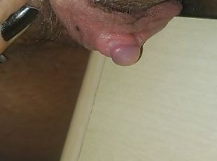 Rubbing huge wet clit on the table