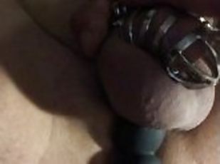 Poor guy is locked in a chastity so he uses a rotating prostate massager for some pleasure