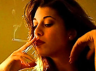 Sexy brunette has a cigarette