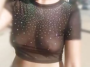 she shows her tits while walking in public in a see-through blouse