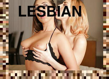 Pair of beautiful lesbians having fun in the living room