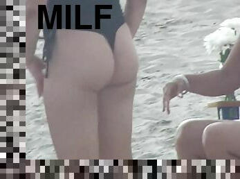 MILF with nice bum beach voyeur scene