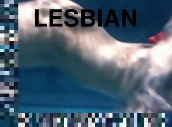 Two hot lesbians underwater touching eachother