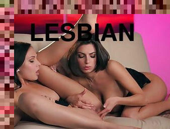 Dark-haired lesbians with natural tits fucking in the living room