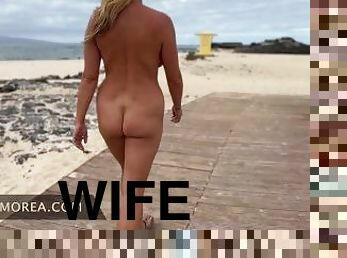 Hotwife walks naked on public beach fully exposed flashing strangers