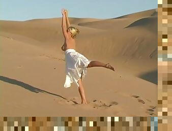 Bendy busty teen babe shows off natural assets on sand dunes