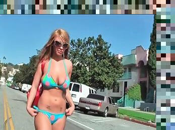 Her bikini body is hot as she walks down the street