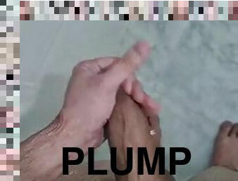 Plump boy has fun in the shower