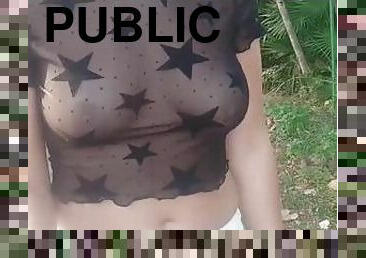 she walks on the road in a see-through blouse and flashes her tits in public