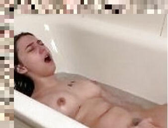 Cute brunette in hot bath