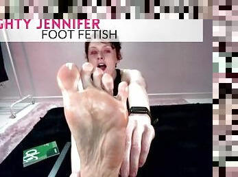 Naughty Jennifer rubs lotion on her feet