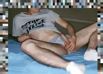 Teenager with grey underwear and sports socks masturbates and shots his sperm