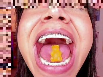 Lila Jordan swallows a yellow gummy bear, Giantess Vore fetish