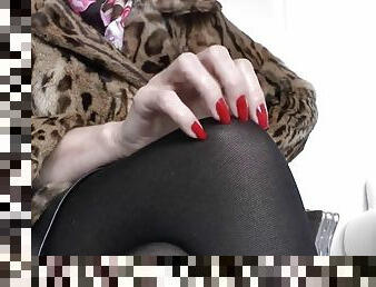 Red nails and a fur jacket