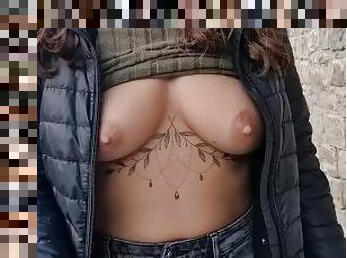 publicly shows her tits in the city center while walking on the sidewalk.  nipples sticking out from