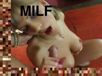 very attractive MILF gives a great handjob