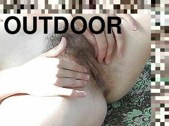 Nata enjoys outdoor masturbation in the sun