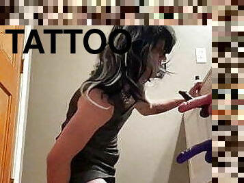 Tattooed CD sucking dildos and taking a huge cock in the ass