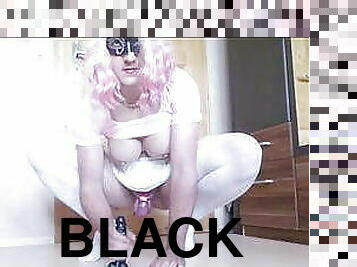 Riding a black dildo with my new pink chastity cage on