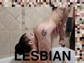 Lesbians getting soupy with each other in the bath  kissing