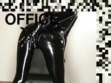 Girl in latex in the office