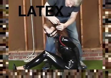 Latex suit ambinder panel gag hogtie