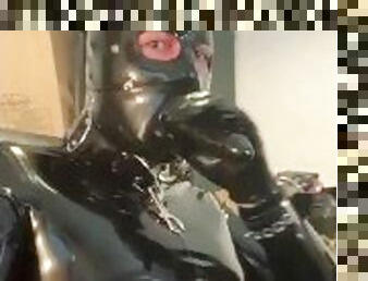 Full rubber gimp enjoys dildo gag