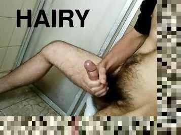hairy guy jerking off in the bathroom