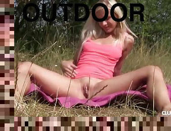 Very horny blonde solo model fingering her pink slit outdoors