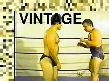 Two professional wrestlers fight naked in a boxing rink