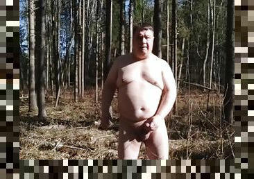Masturbating naked in winter forest