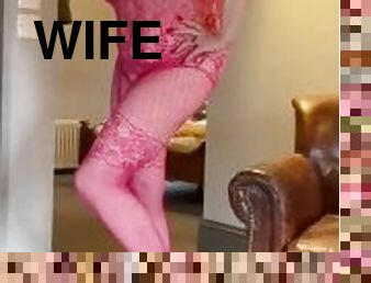 Pink bodystocking and heels