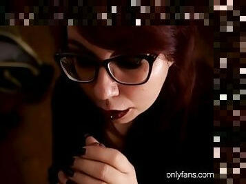 Redhead with glasses gives deepthroat and a handjob