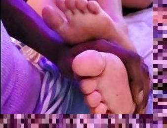 Rubbing my feet on a black man