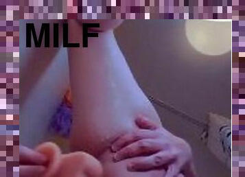 Slutty Milf fucks herself in the shower with her XL dildo