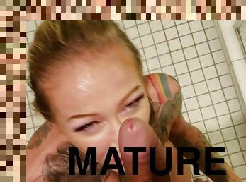 Inked mature with bubbly tits gets sodomized in the bathroom