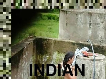 Indian Village Girl Bathing Near Water Tank Outdoor