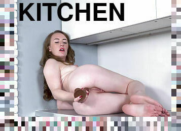 Young Ukrainian Emma Fantazy caresses her pussy in the kitchen