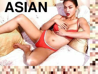 Naked Asian with big tits Sapphire Young plays with her big cock and tits to cum