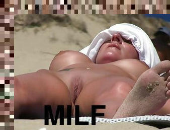 Horny nudists expose their bodies on the sandy beach