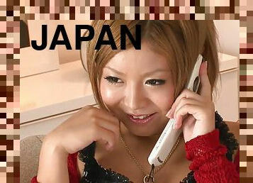 Sexy Japanese babe masturbates while she is on the phone