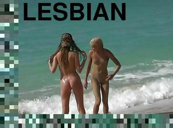 Fully naked lesbian teens have fun on the beach