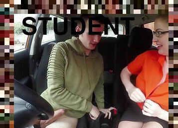 Excited blondie saddles a driving student in the backseat