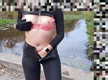 Girl masturbates in a park near the river