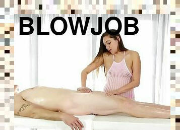 Pretty masseuse blowjob cock under the massage table