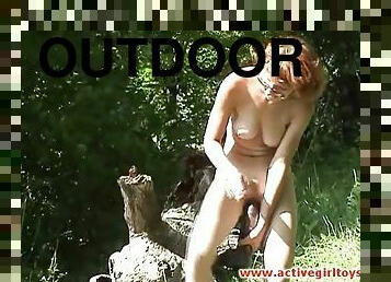 Girl and her giant toy masturbate in the woods