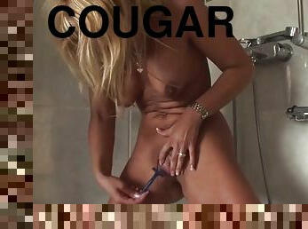 Blonde cougar shaving in the shower blows cock