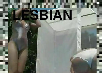 Two lesbian teens satisfy their pussies by the pool