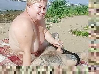 Sucking cock and masturbating on a public beach