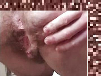 showing off both hairy holes while I piss